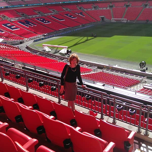 Dr Antoinette Kenny founder and director of HeartScan is pictured standing between the seats of Wembley Stadium where the Cardiology in British Sport 2018 Event took place